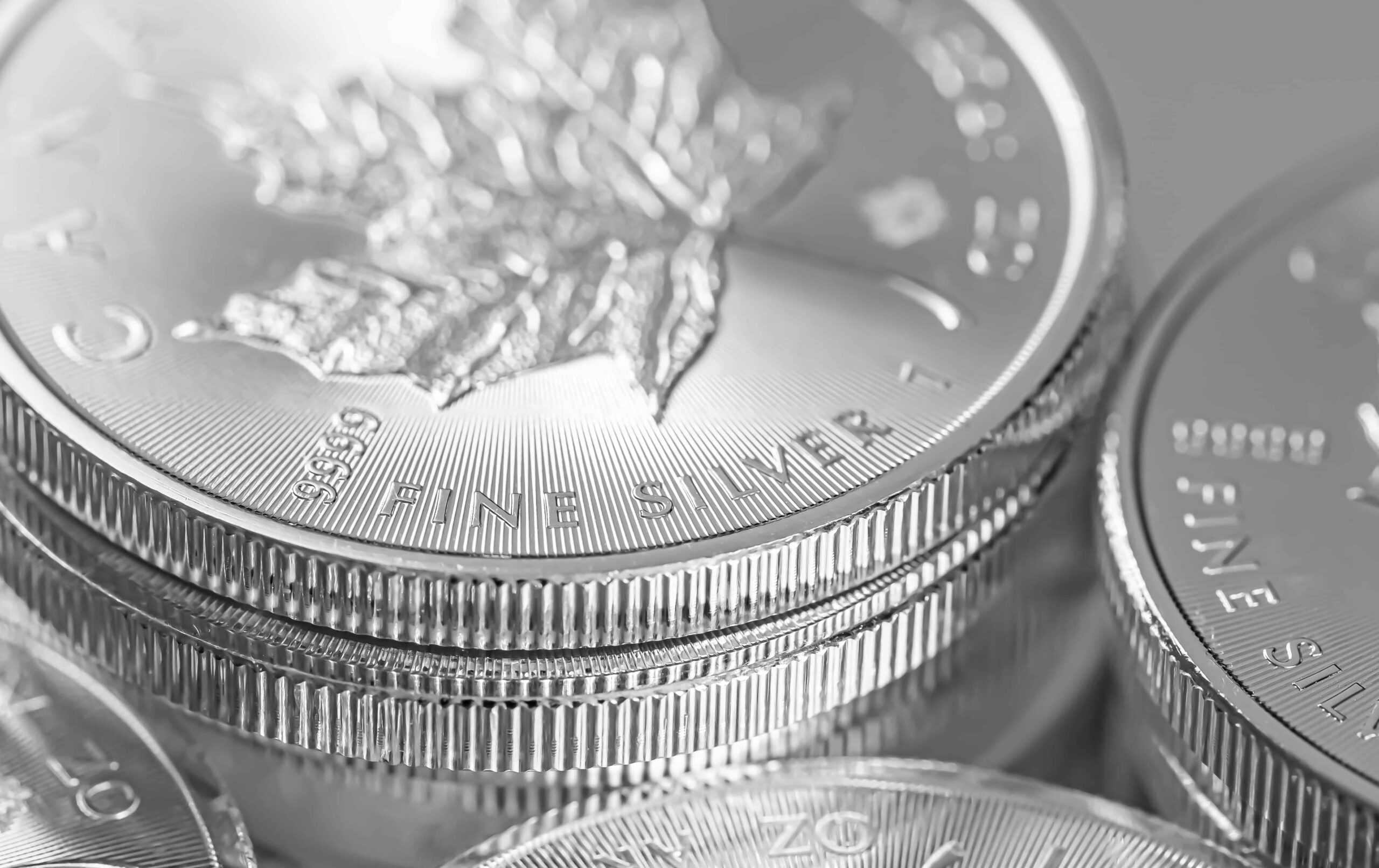 closeup shot of maple leaf fine silver coins from the royal canadian mint scaled