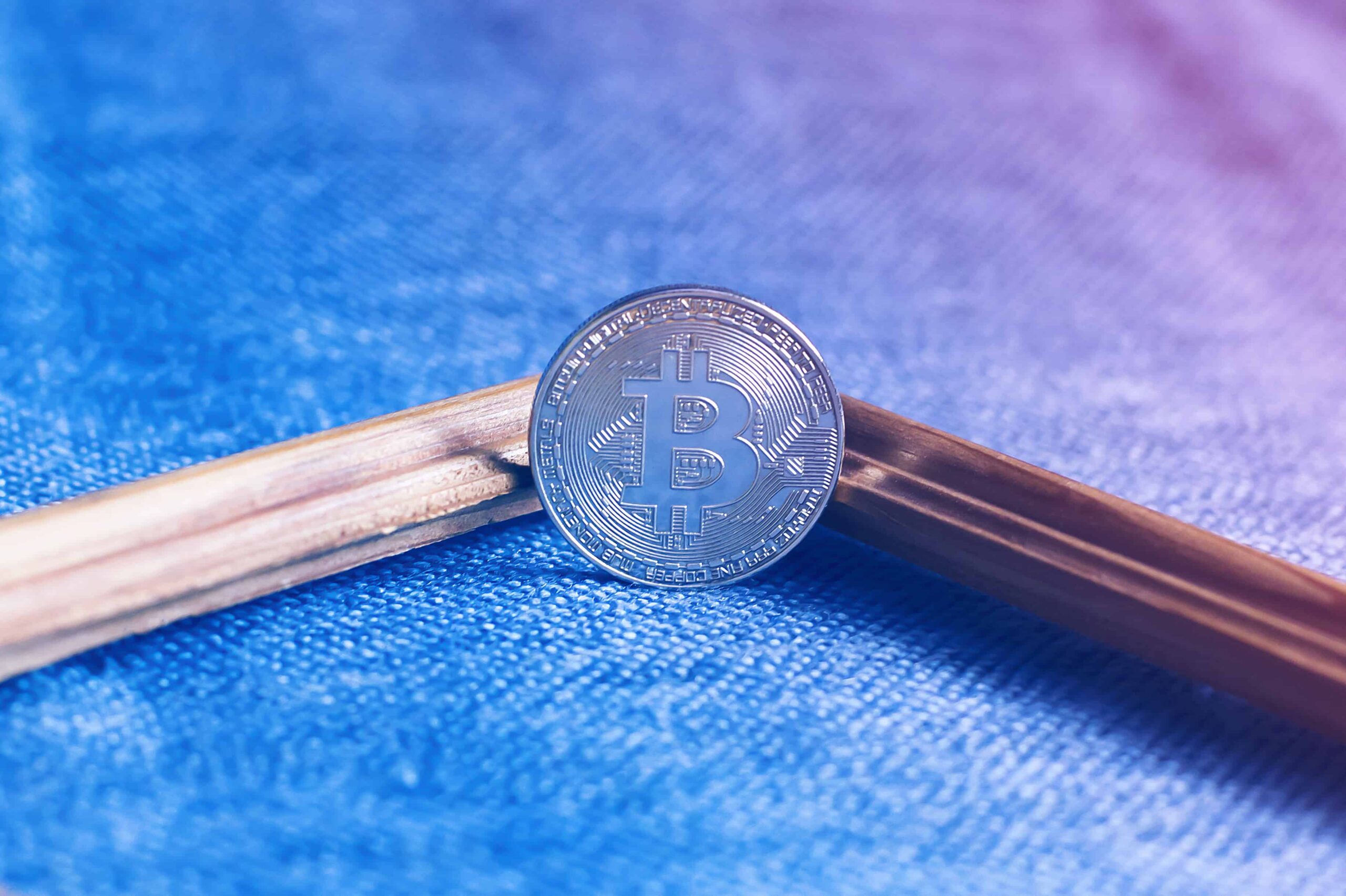 bitcoin in the frame on blue background scaled